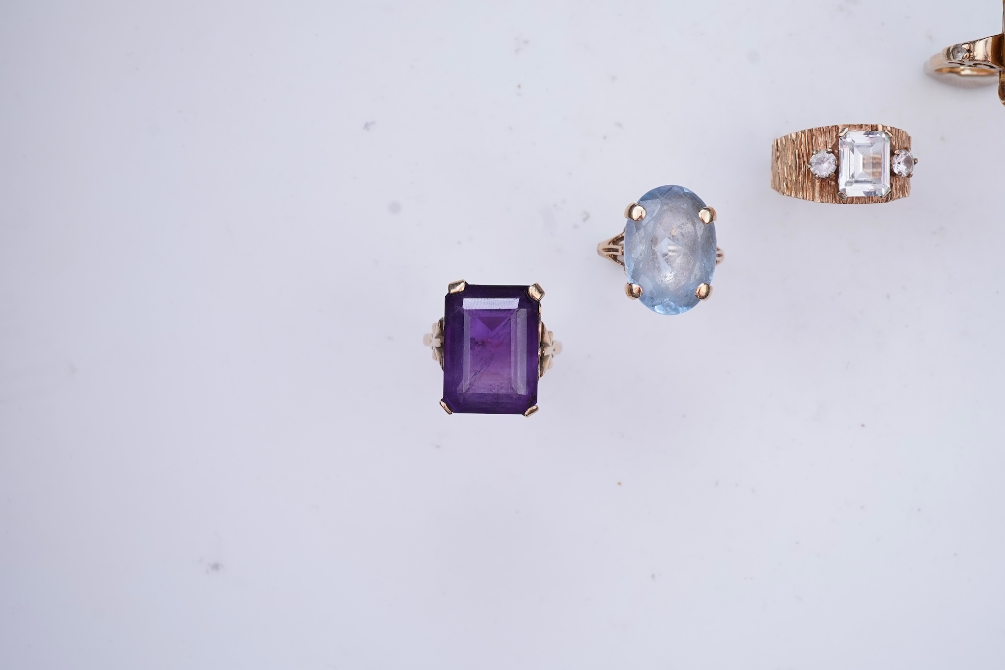 Four gem-set rings